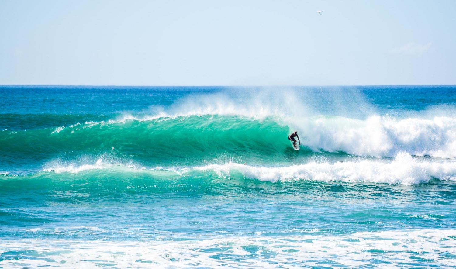 What are the reasons behind taking surfing lessons in Cabo San Lucas?